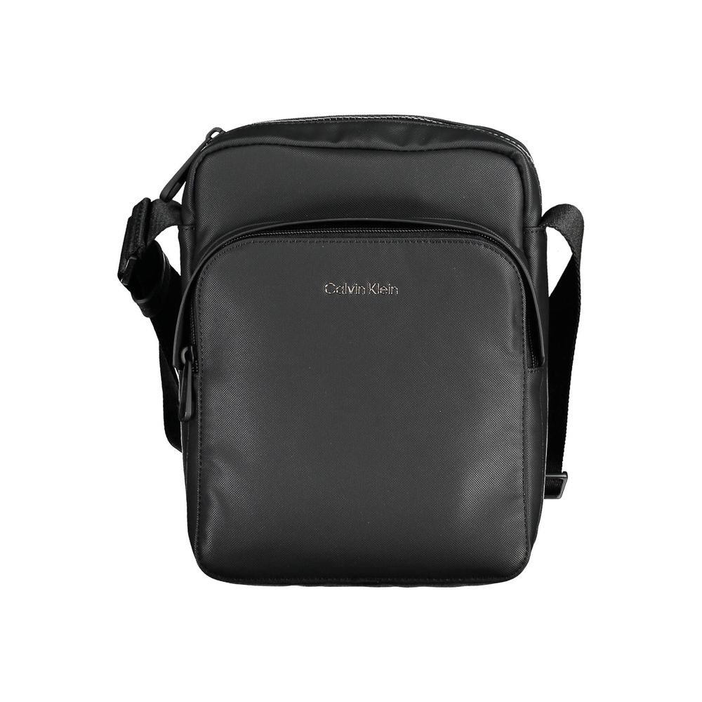 Black Polyester Men Shoulder BagExperience the pinnacle of functional style with this sleek Calvin Klein shoulder bag. Crafted from eco-conscious materials for the modern trendsetter, this bag boasts a bold black hue accentuated by contrasting details tha