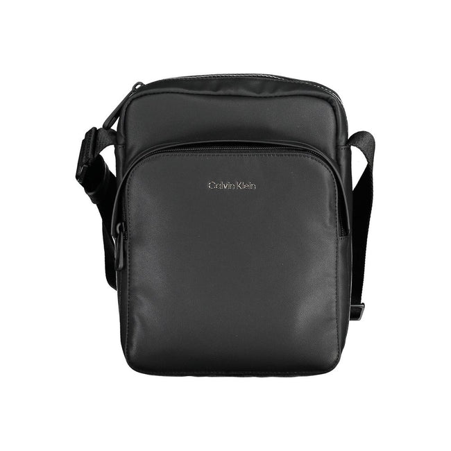 Black Polyester Men Shoulder BagExperience the pinnacle of functional style with this sleek Calvin Klein shoulder bag. Crafted from eco-conscious materials for the modern trendsetter, this bag boasts a bold black hue accentuated by contrasting details tha