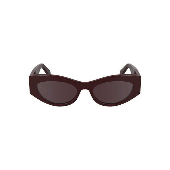 Red Acetate Women SunglassesStep out in style with these chic Calvin Klein Cat Eye Sunglasses, where timeless design meets modern aesthetics. Crafted from eco-friendly bio-acetate, the luscious red frames perfectly encapsulate boldness, while the warm bro