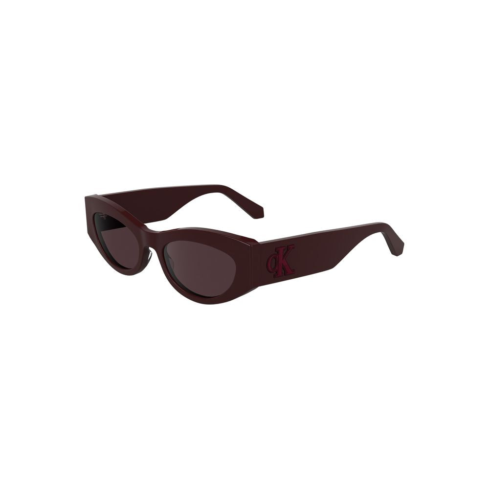 Red Acetate Women SunglassesStep out in style with these chic Calvin Klein Cat Eye Sunglasses, where timeless design meets modern aesthetics. Crafted from eco-friendly bio-acetate, the luscious red frames perfectly encapsulate boldness, while the warm bro