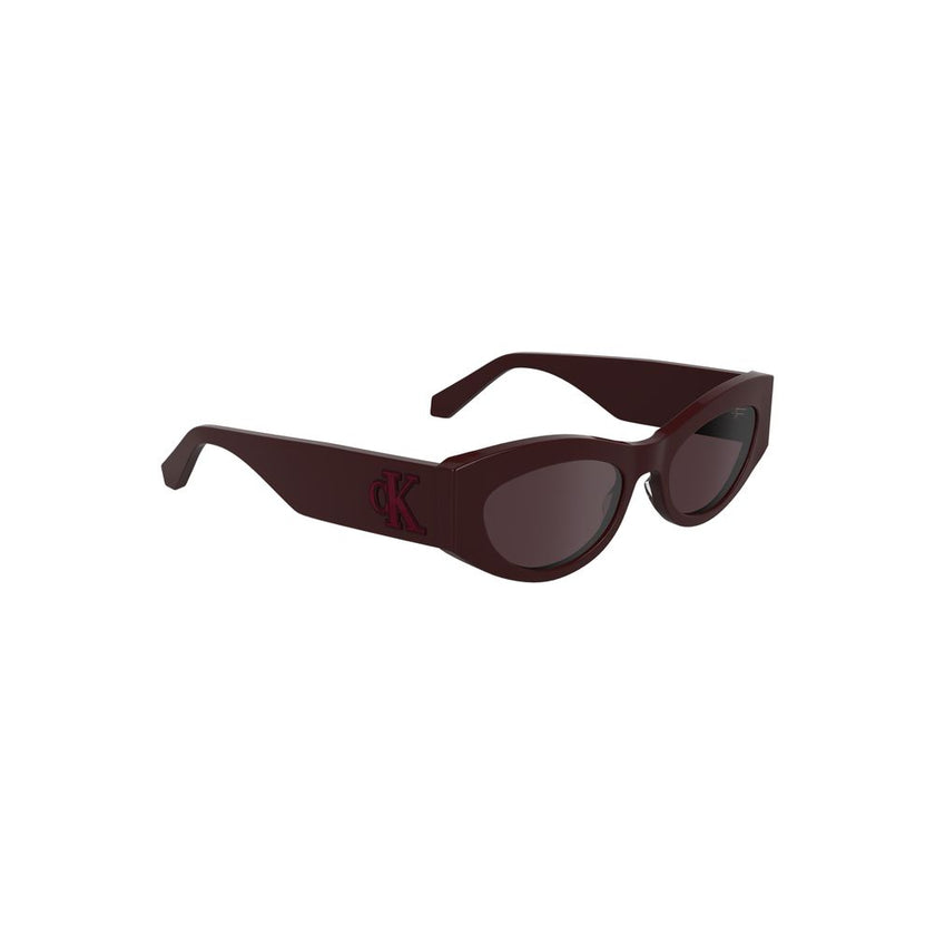 Red Acetate Women SunglassesStep out in style with these chic Calvin Klein Cat Eye Sunglasses, where timeless design meets modern aesthetics. Crafted from eco-friendly bio-acetate, the luscious red frames perfectly encapsulate boldness, while the warm bro