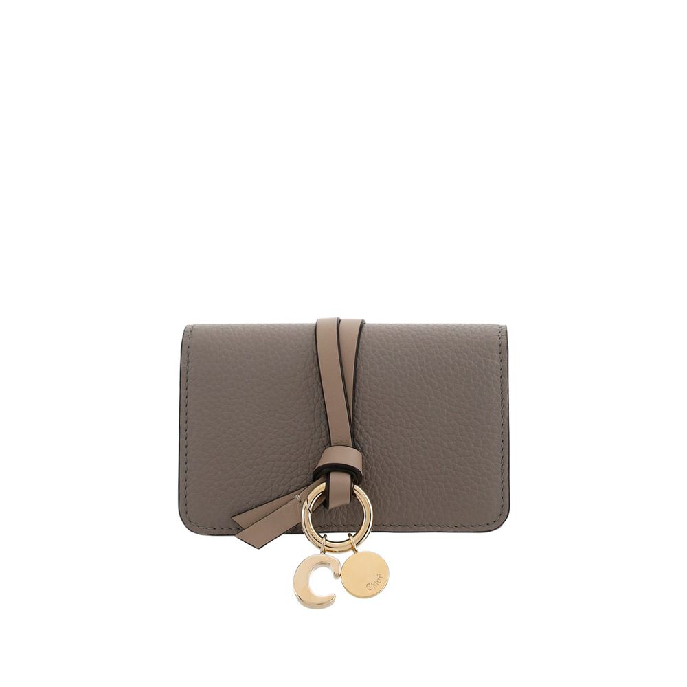 Gray Calf Leather Bos Taurus WalletAlphabet by Chloé Wallet in grained leather, elegant and functional. Featuring a charm detail that adds a touch of personality, it has a snap-button closure for security and convenience. Inside, it features a main compar