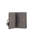 Gray Calf Leather Bos Taurus WalletAlphabet by Chloé Wallet in grained leather, elegant and functional. Featuring a charm detail that adds a touch of personality, it has a snap-button closure for security and convenience. Inside, it features a main compar