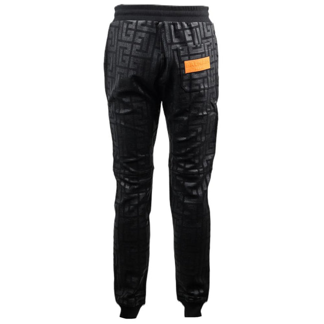 Black Cotton Men Jogging PantStep into the ultimate fusion of comfort and high-fashion with these Balmain black cotton jogging pants. Flaunting a bold all-over pattern print that ensures you’ll stand out in any crowd, these joggers are an essential update