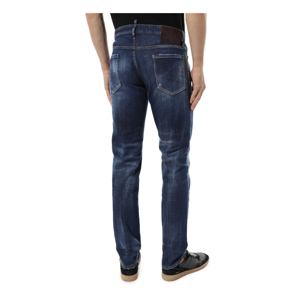 Blue Cotton Men Slim JeanElevate your denim game with the unmistakable edge of Dsquared² Slim Jean jeans. These blue beauties boast an effortlessly cool, slightly faded wash punctuated by deliberate distressing that tells a story of adventure and style. F