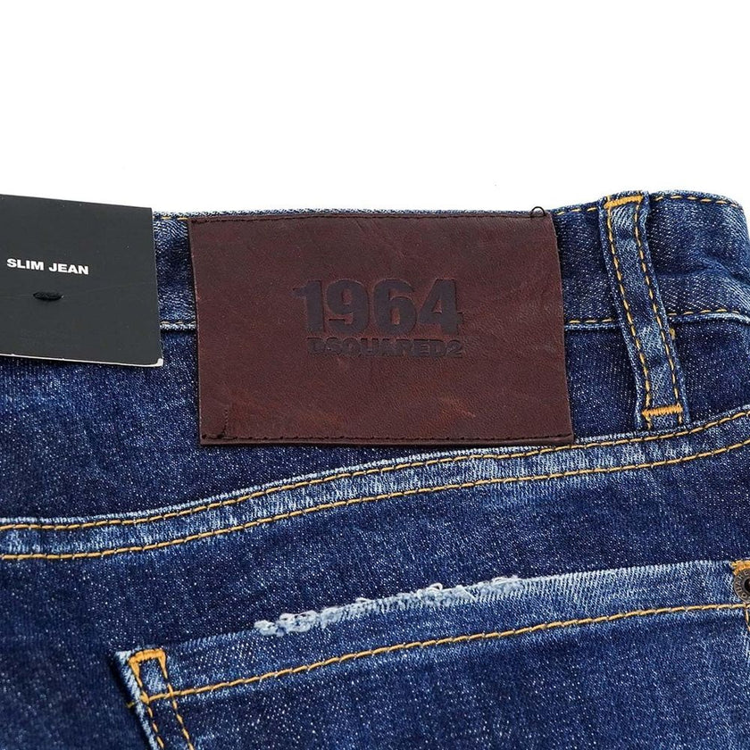 Blue Cotton Men Slim JeanElevate your denim game with the unmistakable edge of Dsquared² Slim Jean jeans. These blue beauties boast an effortlessly cool, slightly faded wash punctuated by deliberate distressing that tells a story of adventure and style. F