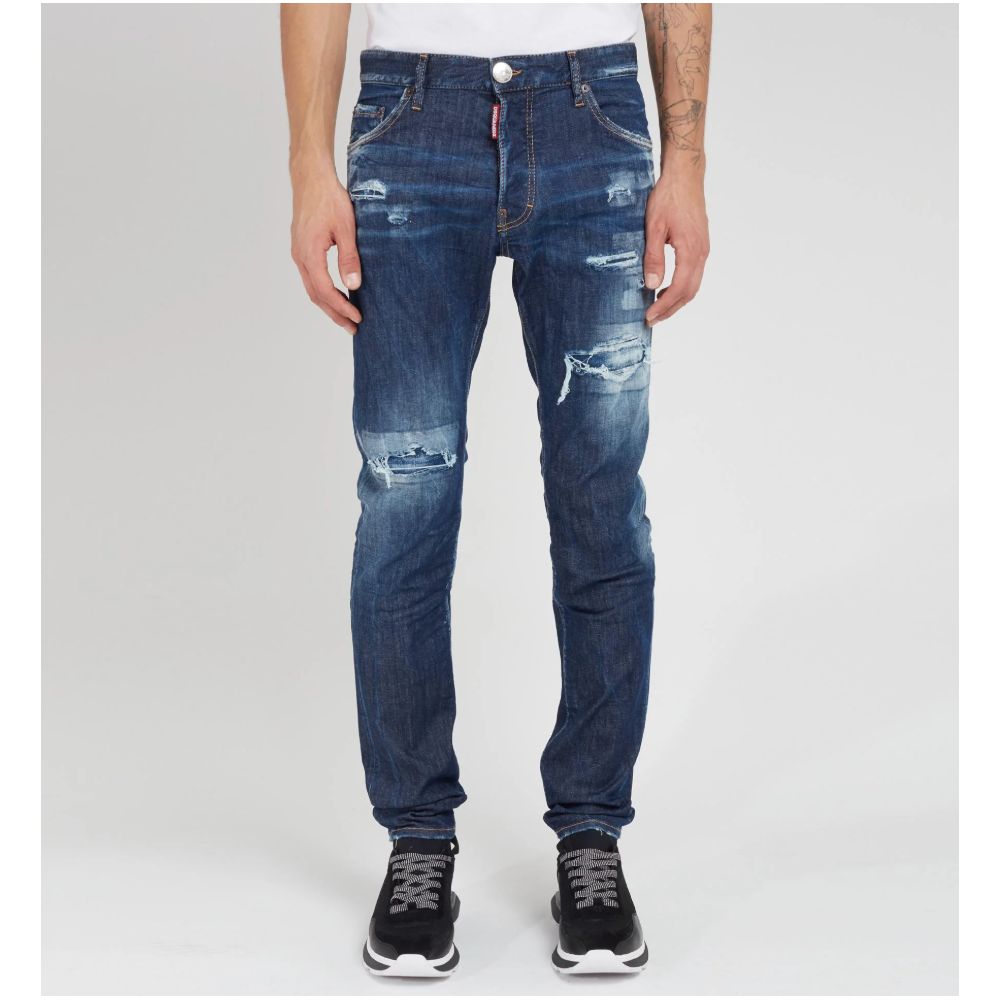 Blue Cotton Men JeansElevate your denim game with Dsquared²’s Cool Guy jeans, the epitome of rugged sophistication. Crafted in Italy, these jeans showcase edgy distressing and a tasteful fade for that perfectly worn-in look. A logo patch on the rear ensur