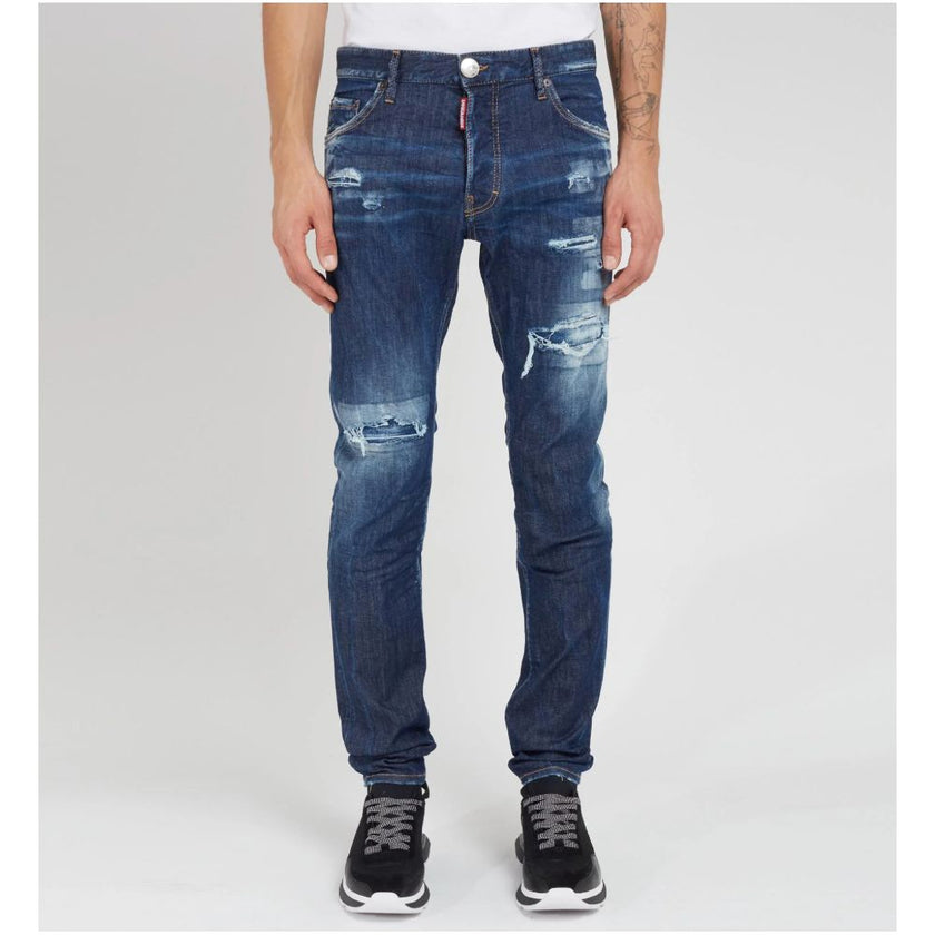 Blue Cotton Men JeansElevate your denim game with Dsquared²’s Cool Guy jeans, the epitome of rugged sophistication. Crafted in Italy, these jeans showcase edgy distressing and a tasteful fade for that perfectly worn-in look. A logo patch on the rear ensur