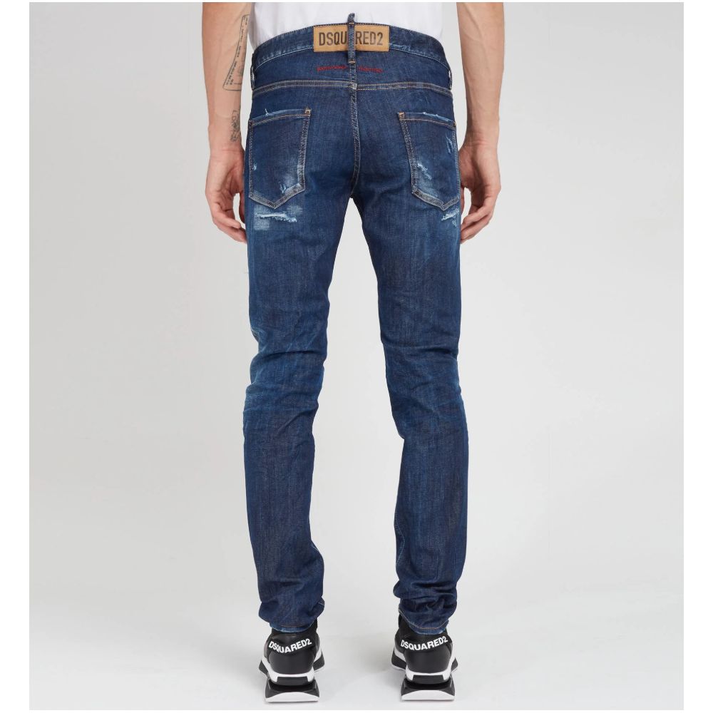 Blue Cotton Men JeansElevate your denim game with Dsquared²’s Cool Guy jeans, the epitome of rugged sophistication. Crafted in Italy, these jeans showcase edgy distressing and a tasteful fade for that perfectly worn-in look. A logo patch on the rear ensur