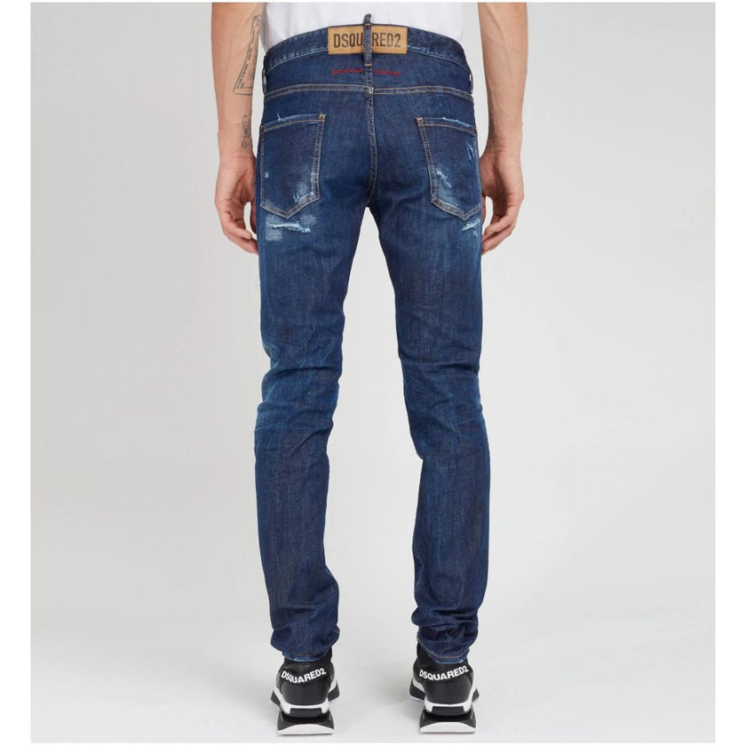 Blue Cotton Men JeansElevate your denim game with Dsquared²’s Cool Guy jeans, the epitome of rugged sophistication. Crafted in Italy, these jeans showcase edgy distressing and a tasteful fade for that perfectly worn-in look. A logo patch on the rear ensur