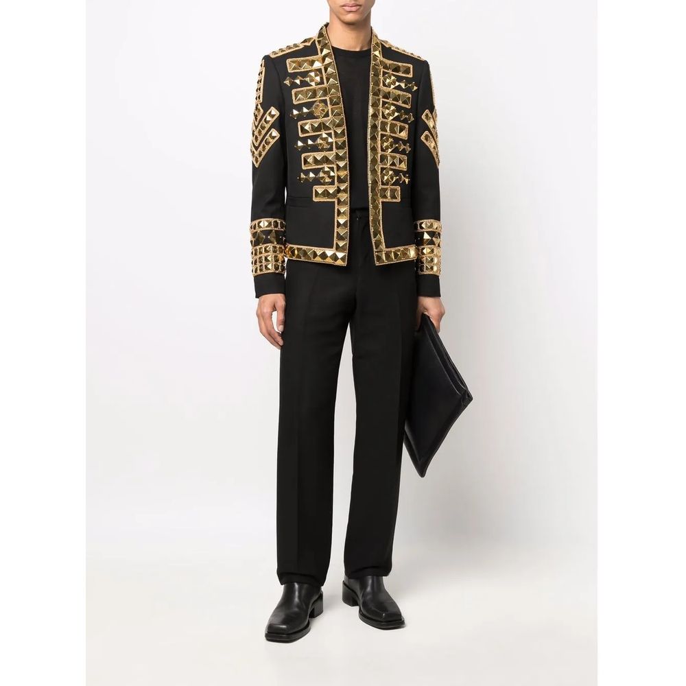 Black Acetate Men's BlazerMake a powerful statement with this exquisitely structured Balmain black blazer. Its gold-tone stud embellishments inject a dose of fearless attitude into your wardrobe, while the sharp, tailored cut ensures an impeccable silhoue