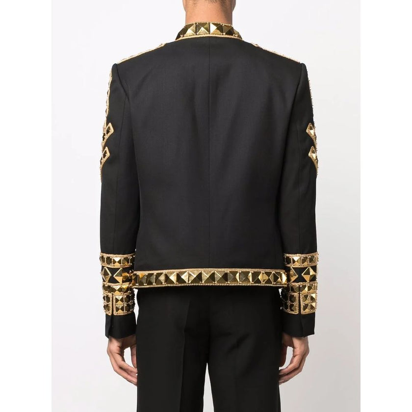 Black Acetate Men's BlazerMake a powerful statement with this exquisitely structured Balmain black blazer. Its gold-tone stud embellishments inject a dose of fearless attitude into your wardrobe, while the sharp, tailored cut ensures an impeccable silhoue