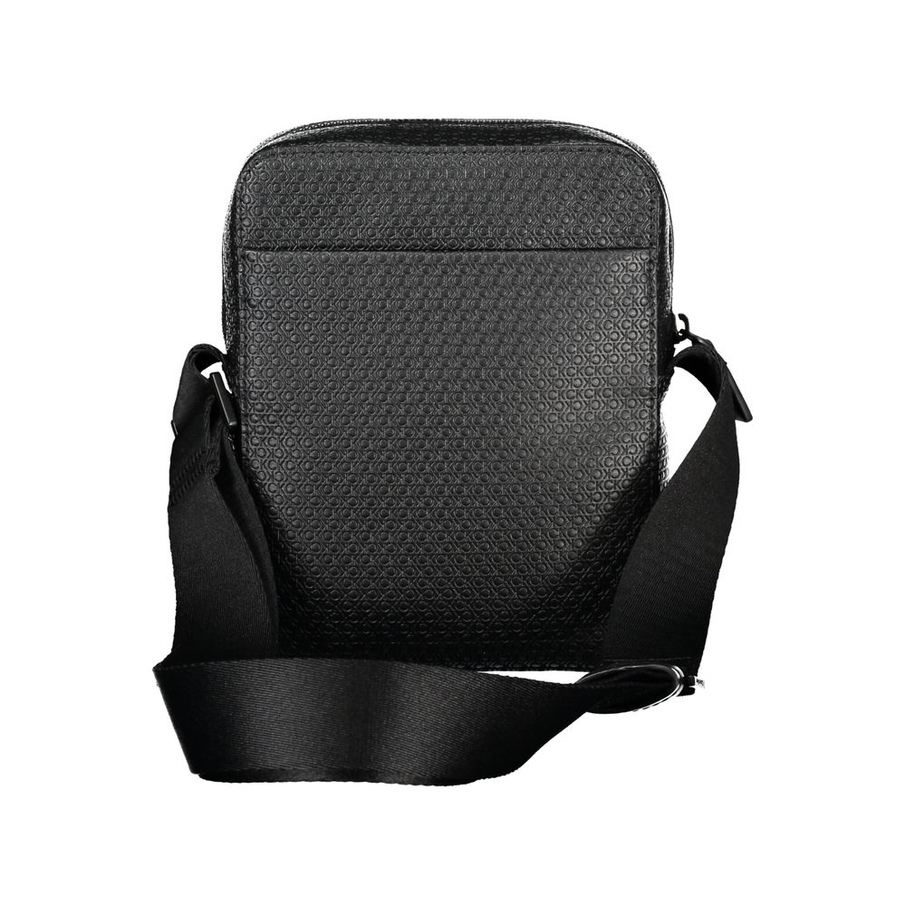 Elegant Black Shoulder Bag with Contrasting AccentsImmerse in the sophistication of Calvin Klein with this elegant black shoulder bag, perfect for the modern man on the move. Designed with functionality and style in mind, it features an adjustable shoulde