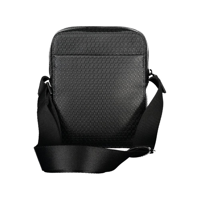 Elegant Black Shoulder Bag with Contrasting AccentsImmerse in the sophistication of Calvin Klein with this elegant black shoulder bag, perfect for the modern man on the move. Designed with functionality and style in mind, it features an adjustable shoulde