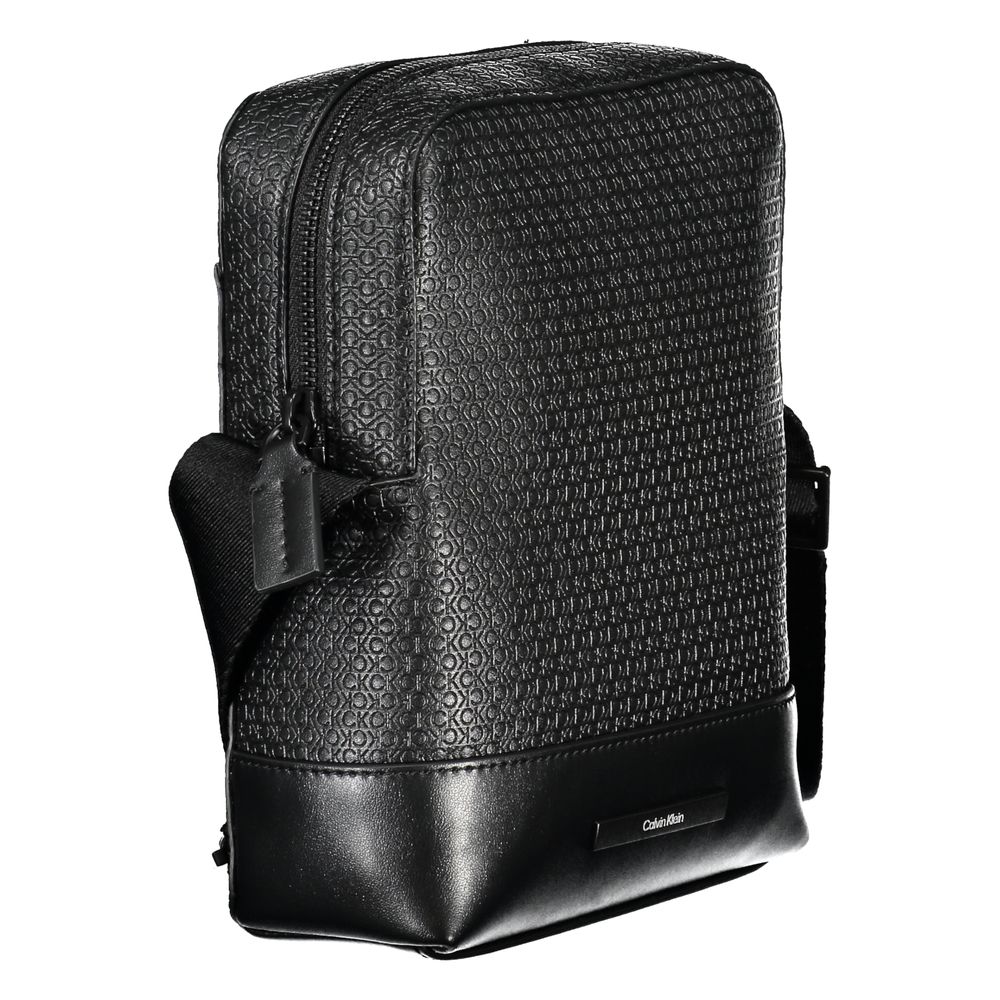 Elegant Black Shoulder Bag with Contrasting AccentsImmerse in the sophistication of Calvin Klein with this elegant black shoulder bag, perfect for the modern man on the move. Designed with functionality and style in mind, it features an adjustable shoulde