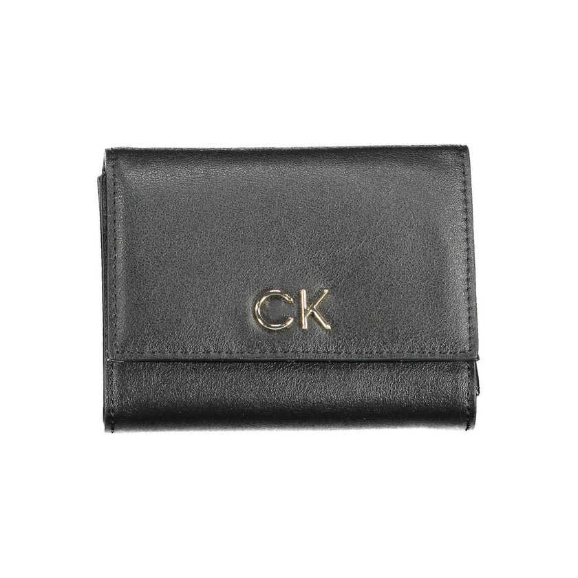 Black Polyester Women WalletElevate your accessory game with the sleek sophistication of Calvin Klein. Perfect for the modern fashionista, this black wallet is a statement piece that combines functionality with a high-fashion edge. Crafted with precision
