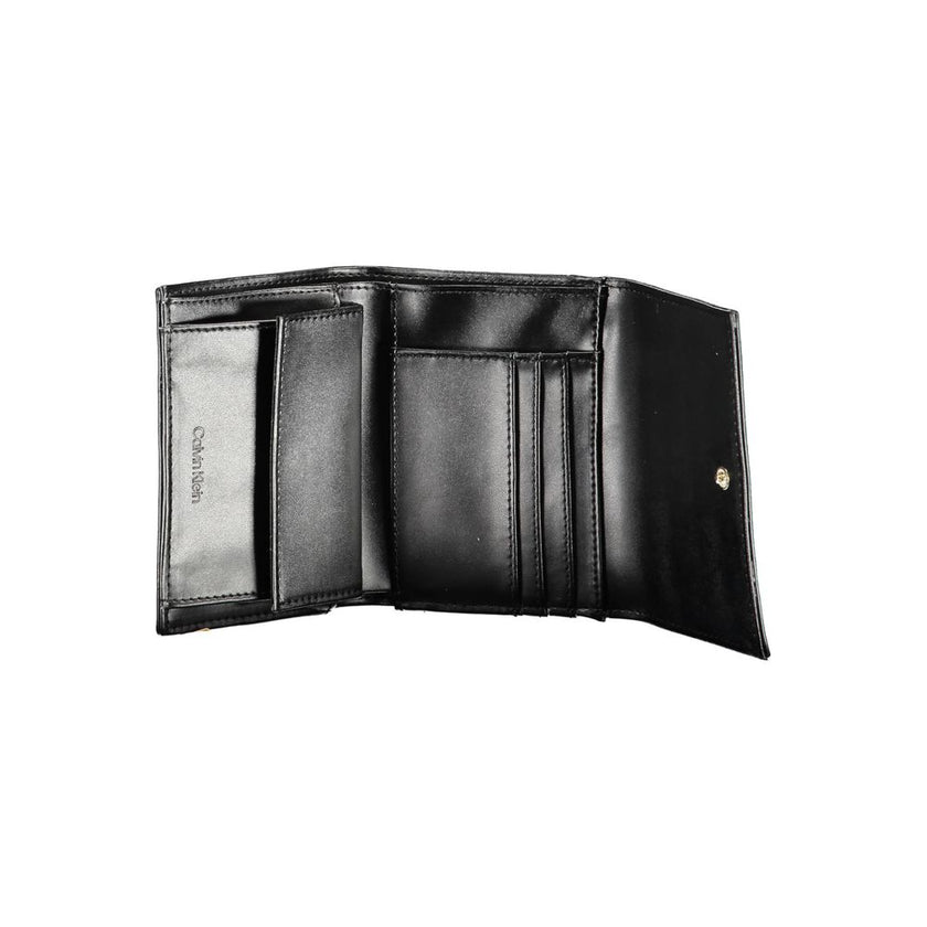 Black Polyester Women WalletElevate your accessory game with the sleek sophistication of Calvin Klein. Perfect for the modern fashionista, this black wallet is a statement piece that combines functionality with a high-fashion edge. Crafted with precision
