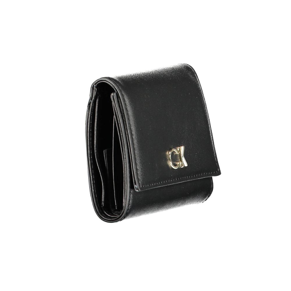 Black Polyester Women WalletElevate your accessory game with the sleek sophistication of Calvin Klein. Perfect for the modern fashionista, this black wallet is a statement piece that combines functionality with a high-fashion edge. Crafted with precision