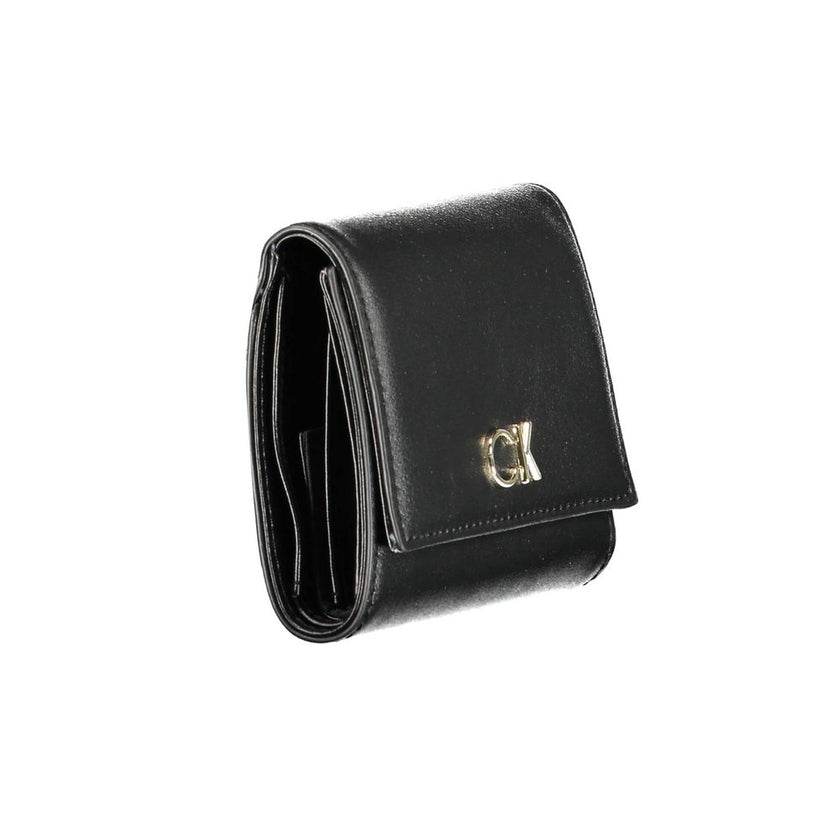 Black Polyester Women WalletElevate your accessory game with the sleek sophistication of Calvin Klein. Perfect for the modern fashionista, this black wallet is a statement piece that combines functionality with a high-fashion edge. Crafted with precision