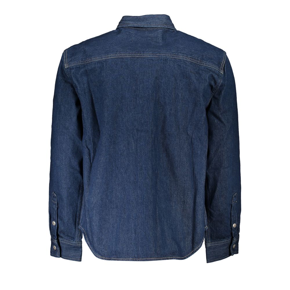 Blue Cotton Men JacketUnleash the essence of timeless fashion with Calvin Klein’s quintessential denim jacket. Meticulously crafted with a regular fit that’s both versatile and undeniably comfortable, it boasts an iconic style that transcends trends. High