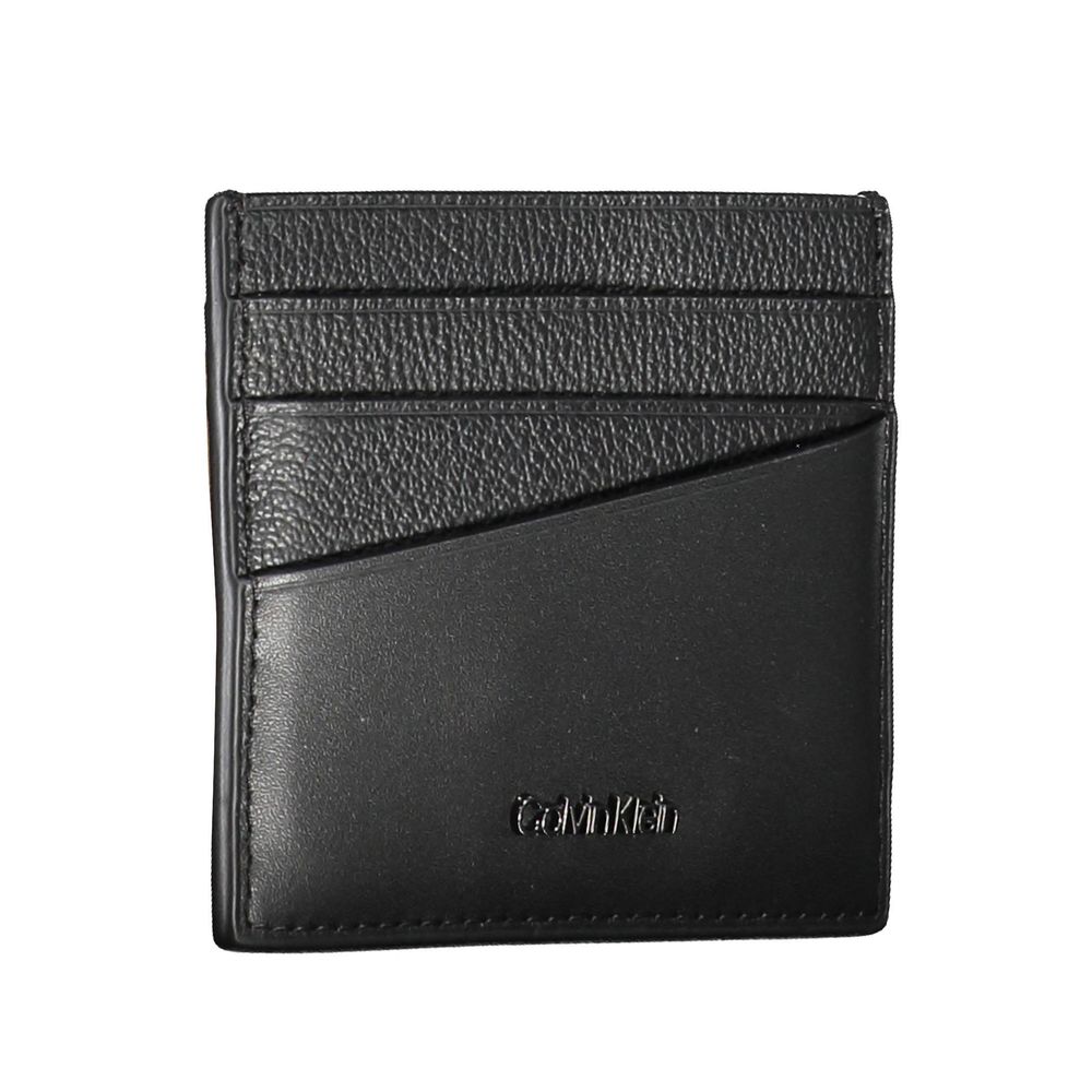 Elegant Leather Card Holder in Timeless BlackStreamline your essentials with this sleek and sophisticated leather card holder from Calvin Klein. Perfect for the minimalist, it features a central pocket designed to hold your cards securely while the iconic