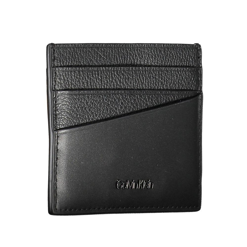 Elegant Leather Card Holder in Timeless BlackStreamline your essentials with this sleek and sophisticated leather card holder from Calvin Klein. Perfect for the minimalist, it features a central pocket designed to hold your cards securely while the iconic