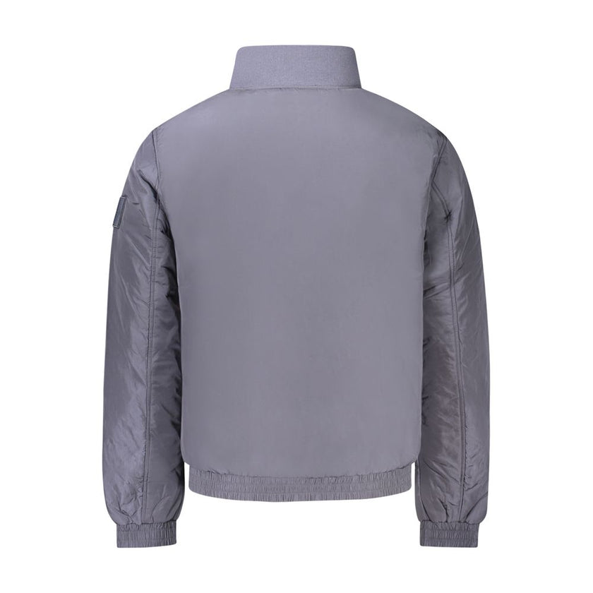 Blue Polyamide Men JacketEmbrace the cutting-edge design of Calvin Klein with this sleek long sleeve jacket. A fashion-forward choice for the modern trendsetter, this piece is crafted to command attention. It features a distinct zip closure and is adorned