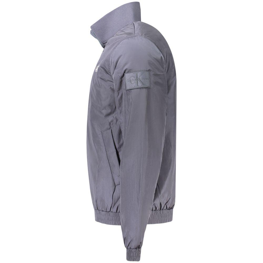 Blue Polyamide Men JacketEmbrace the cutting-edge design of Calvin Klein with this sleek long sleeve jacket. A fashion-forward choice for the modern trendsetter, this piece is crafted to command attention. It features a distinct zip closure and is adorned