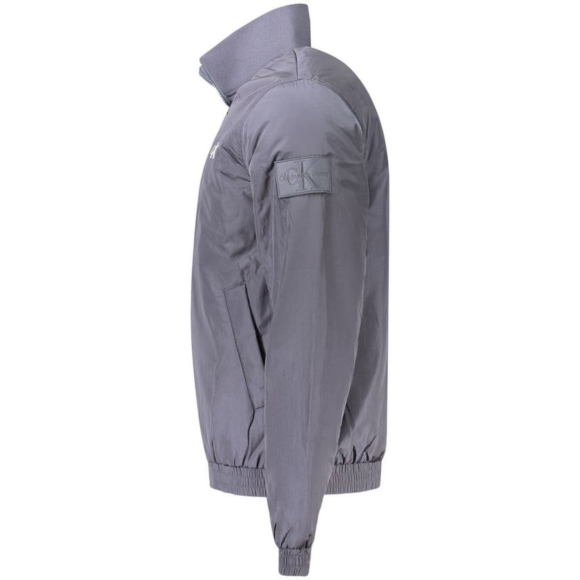Blue Polyamide Men JacketEmbrace the cutting-edge design of Calvin Klein with this sleek long sleeve jacket. A fashion-forward choice for the modern trendsetter, this piece is crafted to command attention. It features a distinct zip closure and is adorned