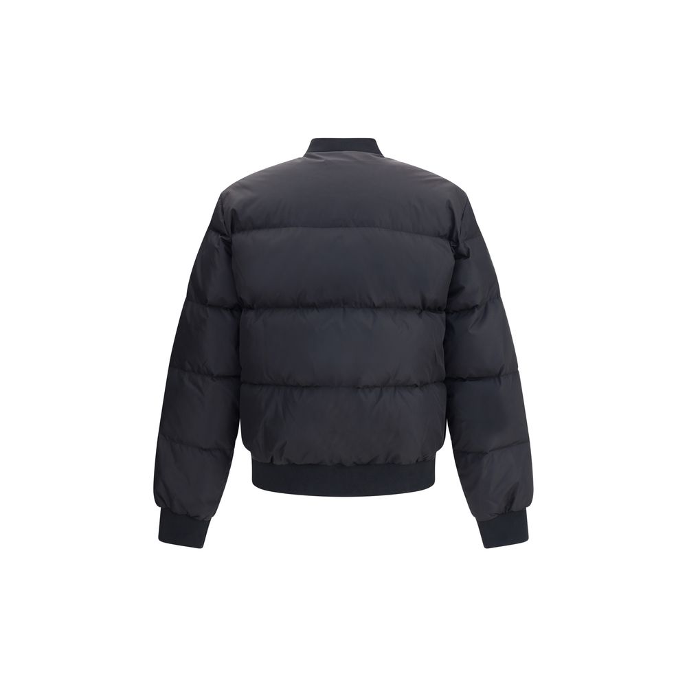 Black Polyamide BomberThe Easy Puffer Down Jacket by Dsquared2 is ideal for tackling the cold season in style. Featuring a quilted and padded design, it features a ribbed collar, cuffs and hem for a snug and comfortable fit. The double-slider front zipper