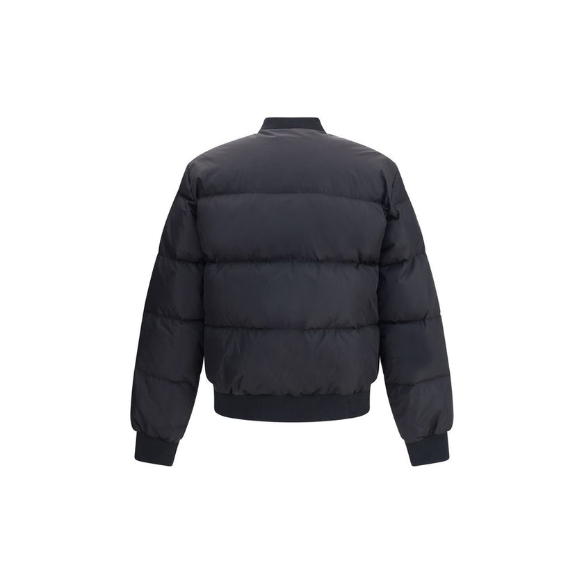 Black Polyamide BomberThe Easy Puffer Down Jacket by Dsquared2 is ideal for tackling the cold season in style. Featuring a quilted and padded design, it features a ribbed collar, cuffs and hem for a snug and comfortable fit. The double-slider front zipper
