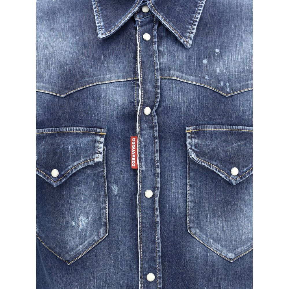 Blue Denim ShirtDsquared2’s Fashion Western shirt combines classic Western style with an urban, lived-in aesthetic. Made of cotton denim with a vintage worn-effect design, it features a classic collar, front button closure and adjustable button cuffs. The