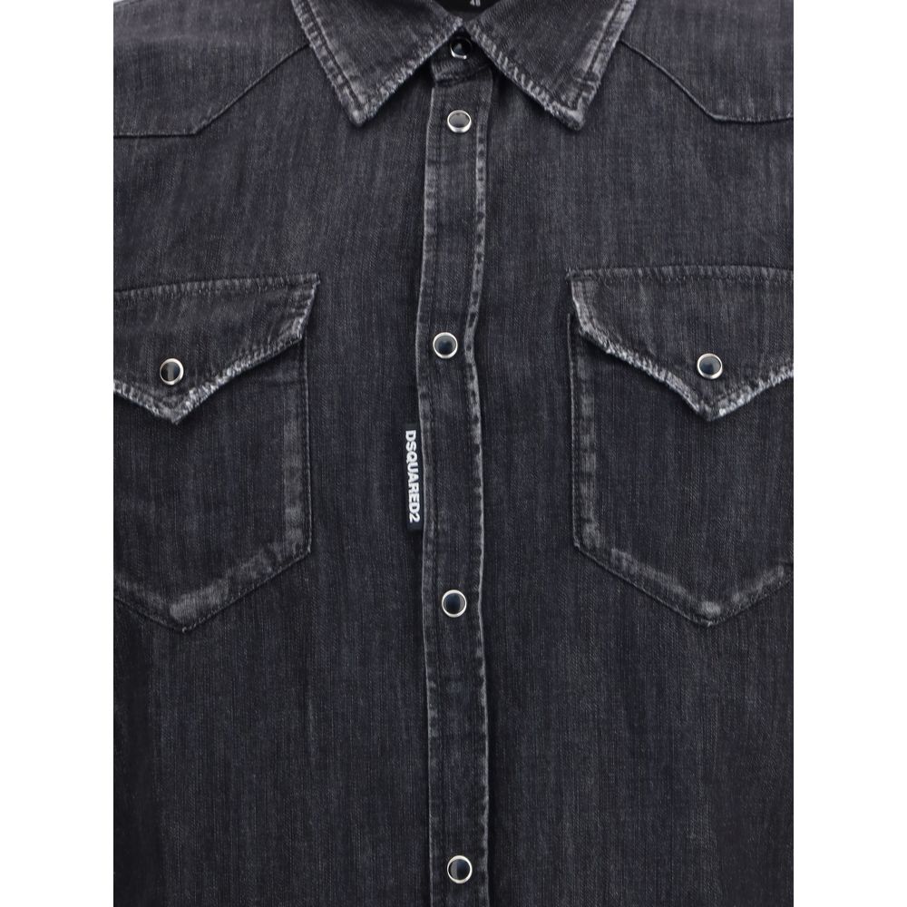 Black Denim ShirtDsquared2’s Classic Western Shirt reinterprets the iconic Western style with a contemporary twist. Made from cotton denim, it features a classic collar, front snap button closure and adjustable cuffs. The two flap patch pockets on the fro