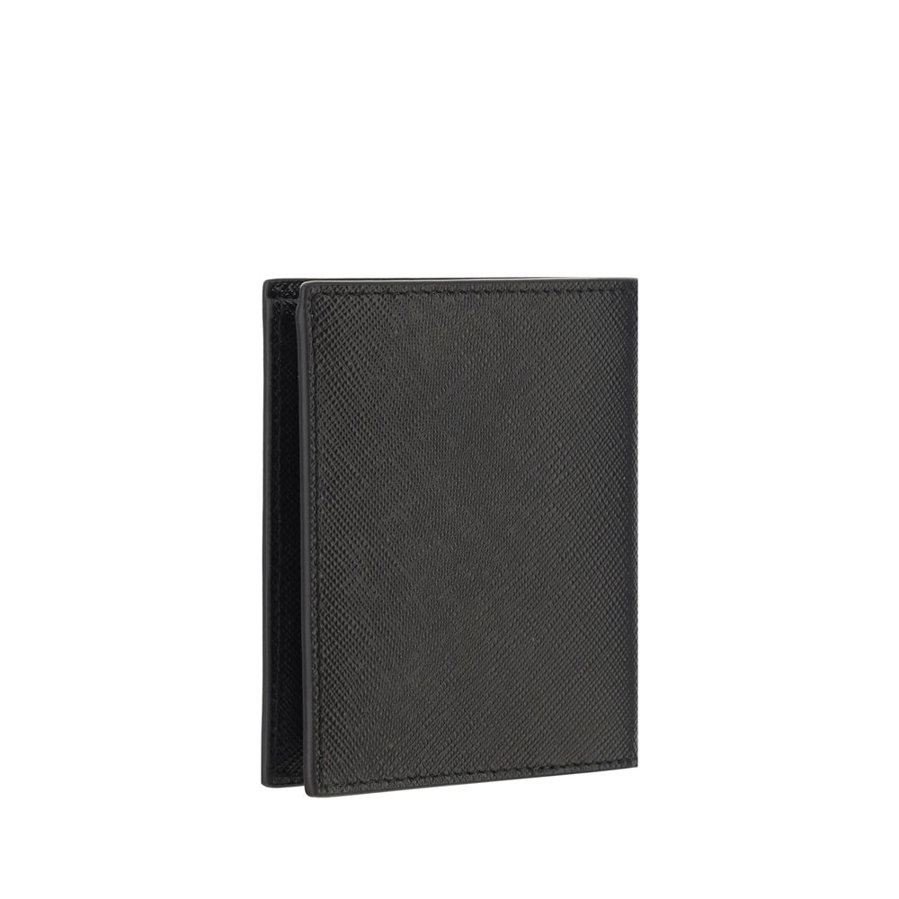 Black Calf Leather Bos Taurus WalletPrada’s Leather Wallet combines elegance and functionality in a refined billfold design. The front features a metal plaque with the iconic logo, while the interior is organized with card slots, two open pockets and a to