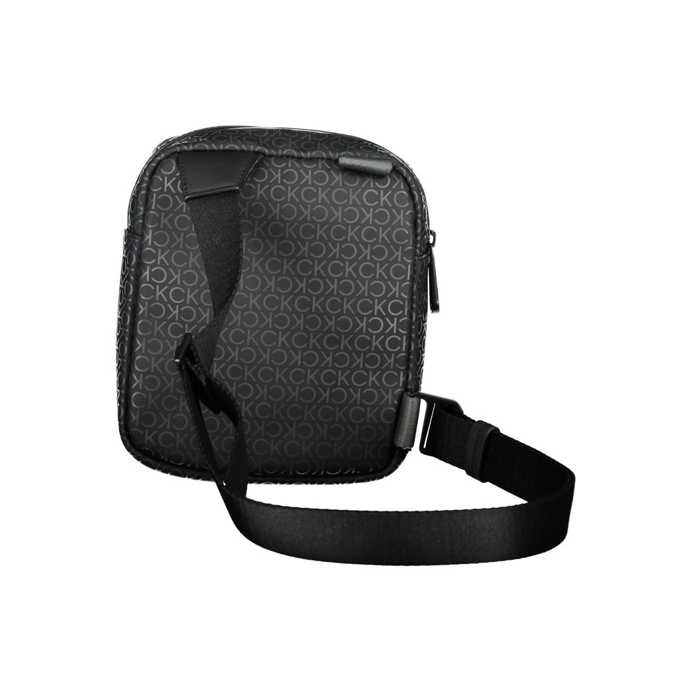 Eco-Conscious Black Shoulder BagDiscover the perfect blend of functionality and eco-conscious design with this Calvin Klein black shoulder bag. Featuring an adjustable shoulder strap for customizable comfort, a secure zip closure, and one internal pocket