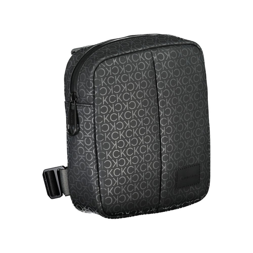 Eco-Conscious Black Shoulder BagDiscover the perfect blend of functionality and eco-conscious design with this Calvin Klein black shoulder bag. Featuring an adjustable shoulder strap for customizable comfort, a secure zip closure, and one internal pocket