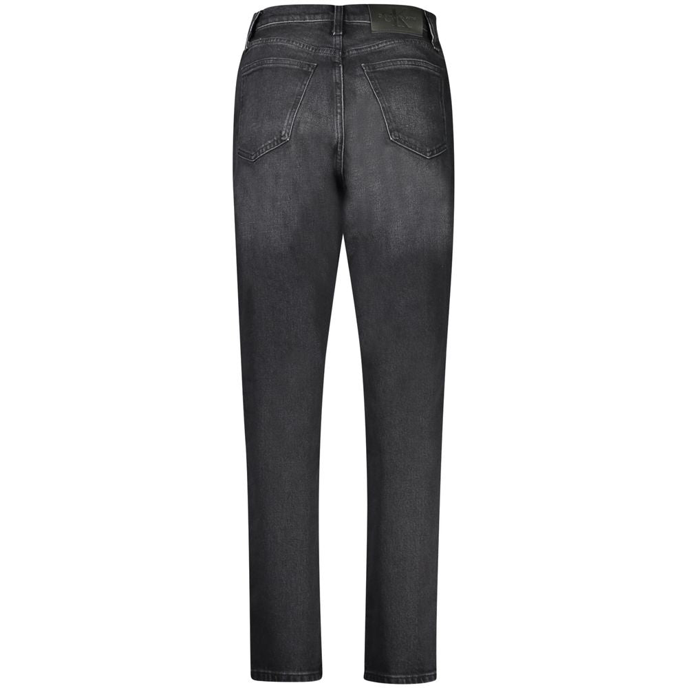 Black Cotton Women JeansDiscover the bold expression of timeless style with these Calvin Klein Mom Jeans. Crafted for those who covet a trendy yet classic silhouette, these jeans feature 5 pockets, a secure button and zip closure, and the iconic Calvin Kl