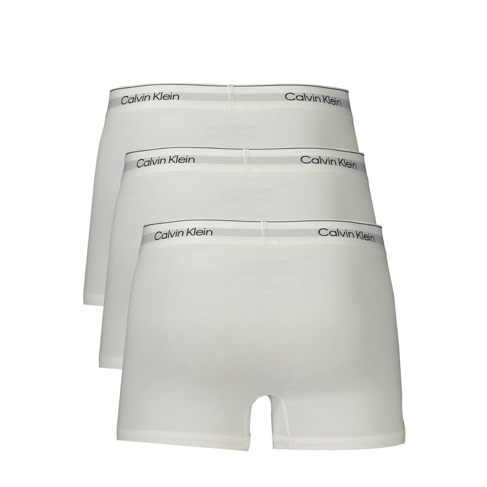 White Cotton Men BoxerElevate your essentials with Calvin Klein’s signature finesse. This tri-pack of Parigamba Shorty boxers blends style with unparalleled comfort, featuring an elastic waistband adorned with the iconic logo. With contrasting details for
