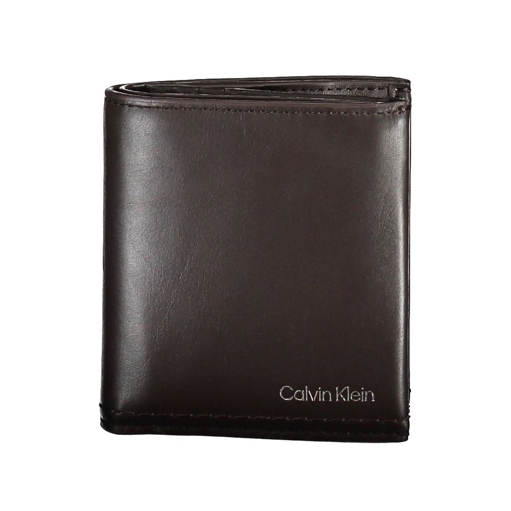 Brown Leather Men WalletElevate your daily essentials with this sleek Calvin Klein wallet, crafted from the finest 100% leather to ensure durability with a touch of sophistication. Featuring two spacious compartments, a handy coin purse, and ample slots f