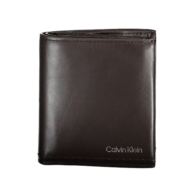 Brown Leather Men WalletElevate your daily essentials with this sleek Calvin Klein wallet, crafted from the finest 100% leather to ensure durability with a touch of sophistication. Featuring two spacious compartments, a handy coin purse, and ample slots f