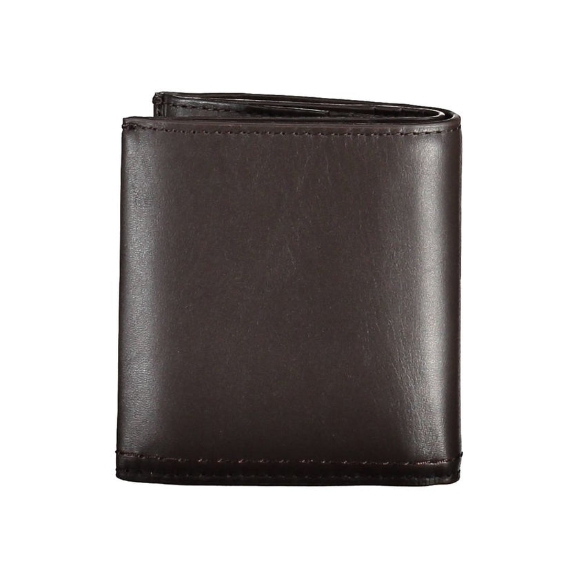 Brown Leather Men WalletElevate your daily essentials with this sleek Calvin Klein wallet, crafted from the finest 100% leather to ensure durability with a touch of sophistication. Featuring two spacious compartments, a handy coin purse, and ample slots f