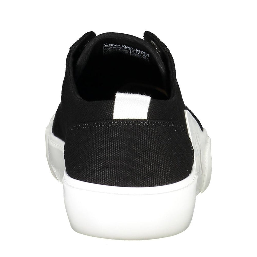 Black Recycled Material Men SneakerElevate your streetwear game with the Calvin Klein difference. A fusion of fashion and sustainability, these sneakers boast a bold black palette accented with striking contrasting details and the iconic logo for an unmis