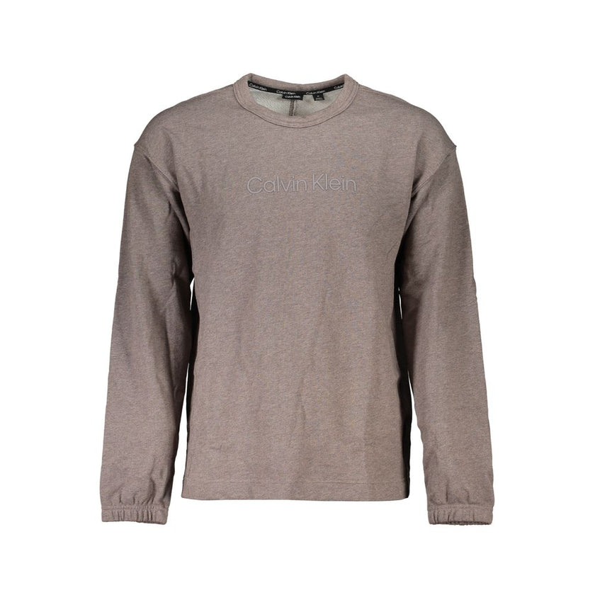 Brown Cotton Men SweaterUnleash your style with the quintessential boldness of Calvin Klein. This sweatshirt isn’t just a layer; it’s a statement with its striking logo print and sleek crew neck design. Crafted for both comfort and impact, it’s the go-to
