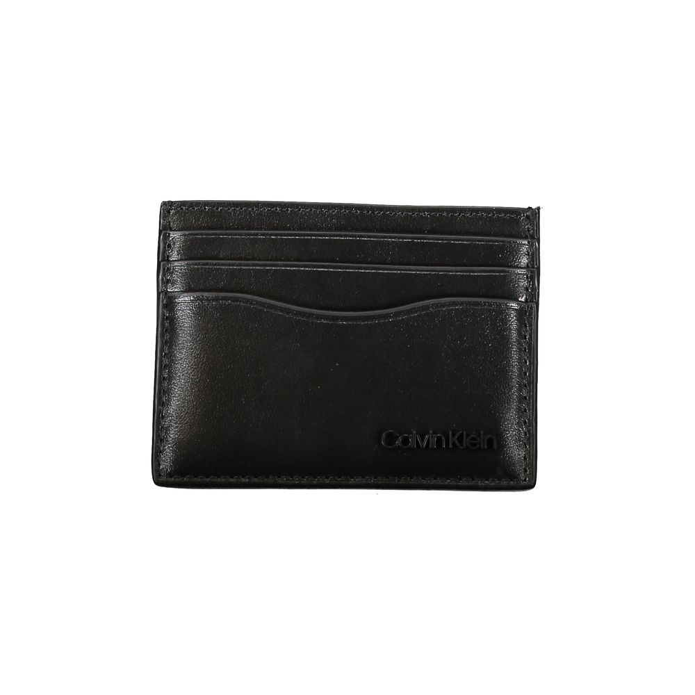 Sleek Black Leather Card HolderElevate your essentials with this sleek black card holder, designed to encapsulate elegance and functionality. Perfect for the discerning individual, this minimalist accessory ensures your cards are securely stored in style.