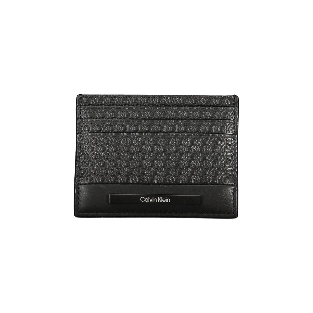Sleek Black Contrast Card HolderEmbrace the epitome of modern sophistication with this sleek Calvin Klein card holder. Designed for the minimalist who appreciates a touch of elegance, this accessory boasts a central pocket lined with contrast details and