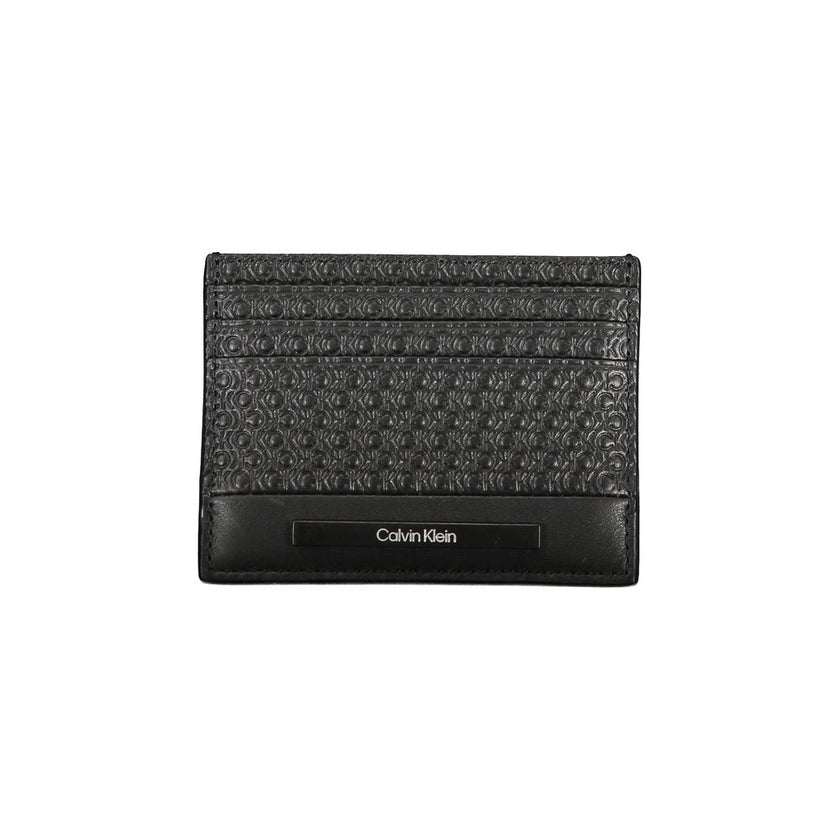 Sleek Black Contrast Card HolderEmbrace the epitome of modern sophistication with this sleek Calvin Klein card holder. Designed for the minimalist who appreciates a touch of elegance, this accessory boasts a central pocket lined with contrast details and