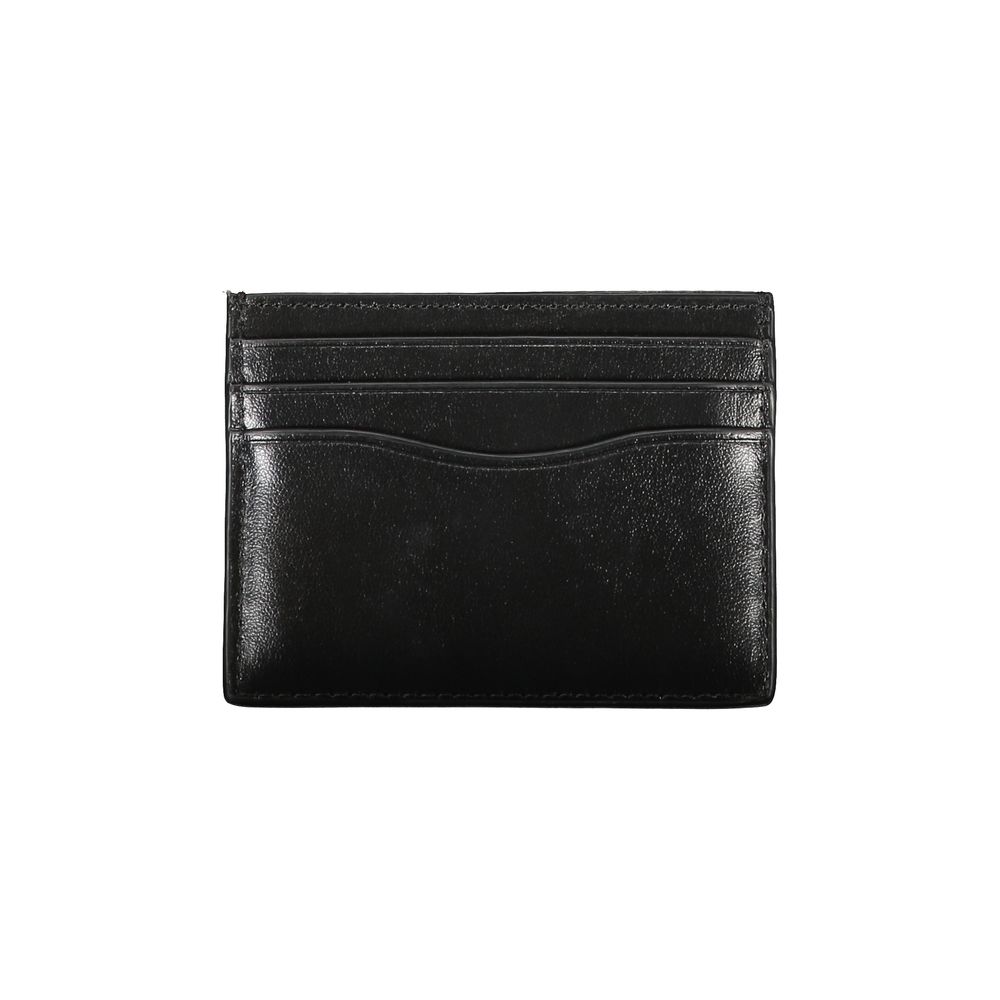 Sleek Black Leather Card HolderElevate your essentials with this sleek black card holder, designed to encapsulate elegance and functionality. Perfect for the discerning individual, this minimalist accessory ensures your cards are securely stored in style.