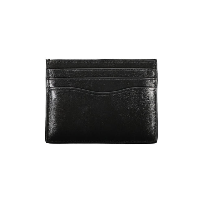 Sleek Black Leather Card HolderElevate your essentials with this sleek black card holder, designed to encapsulate elegance and functionality. Perfect for the discerning individual, this minimalist accessory ensures your cards are securely stored in style.
