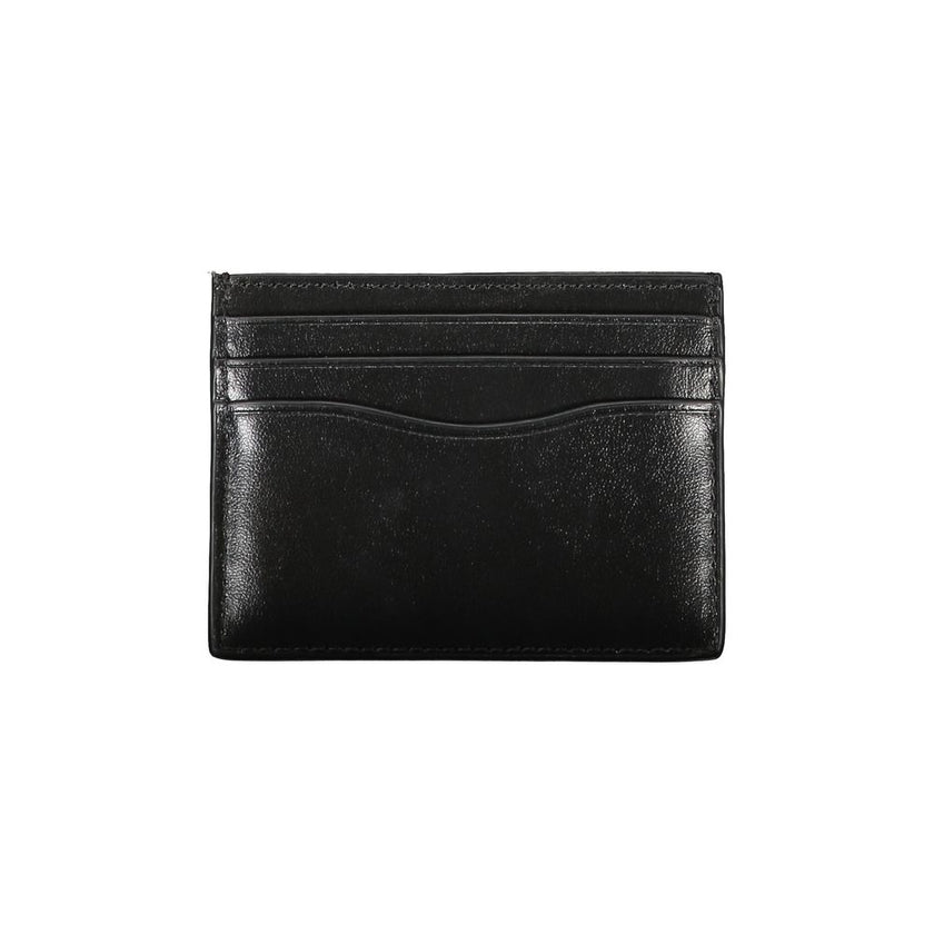 Sleek Black Leather Card HolderElevate your essentials with this sleek black card holder, designed to encapsulate elegance and functionality. Perfect for the discerning individual, this minimalist accessory ensures your cards are securely stored in style.
