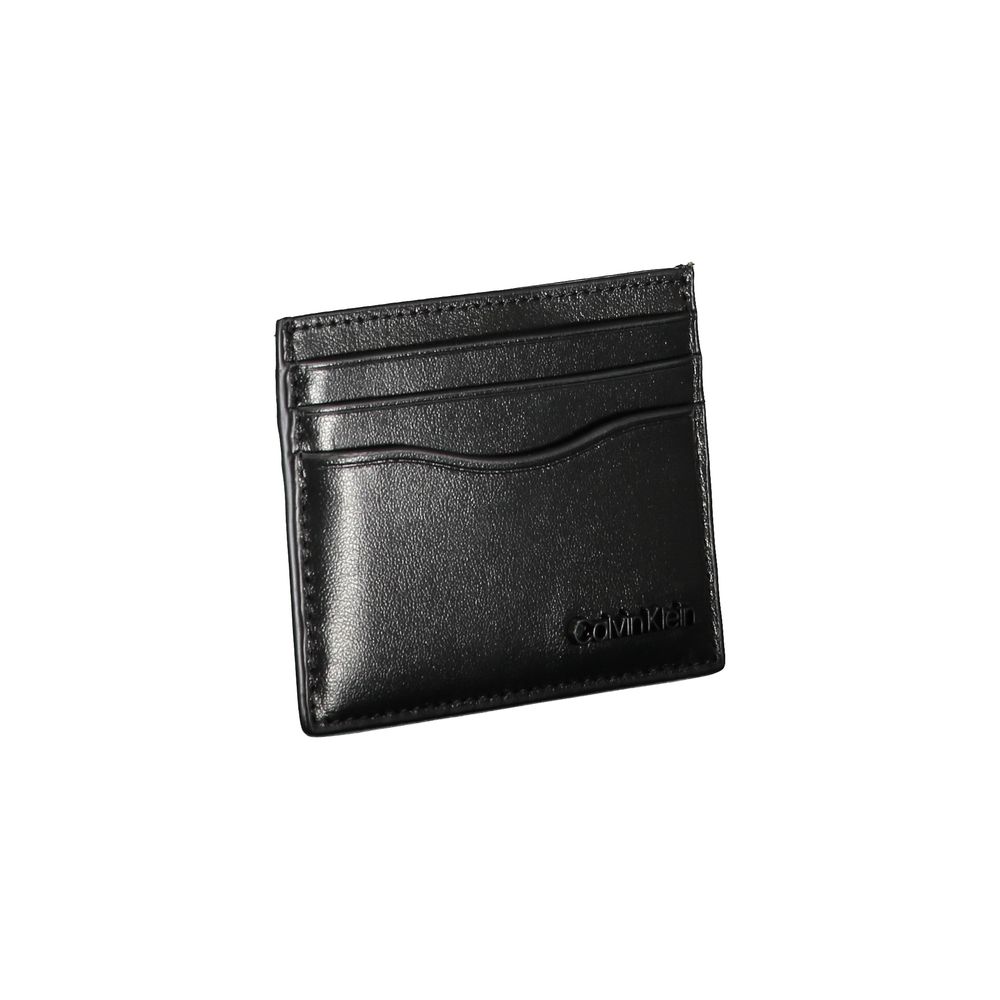 Sleek Black Leather Card HolderElevate your essentials with this sleek black card holder, designed to encapsulate elegance and functionality. Perfect for the discerning individual, this minimalist accessory ensures your cards are securely stored in style.